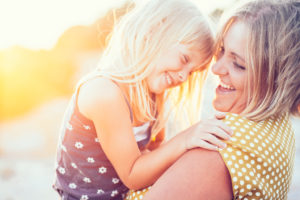 mom and her daughter in sunlight