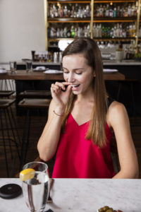 Girl inserting invisible aligner