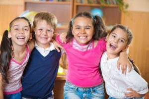 group of kids smiling and laughing