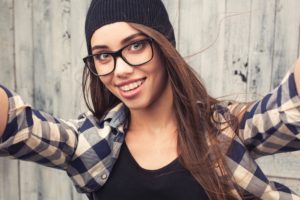 teen girl smiling with clear braces