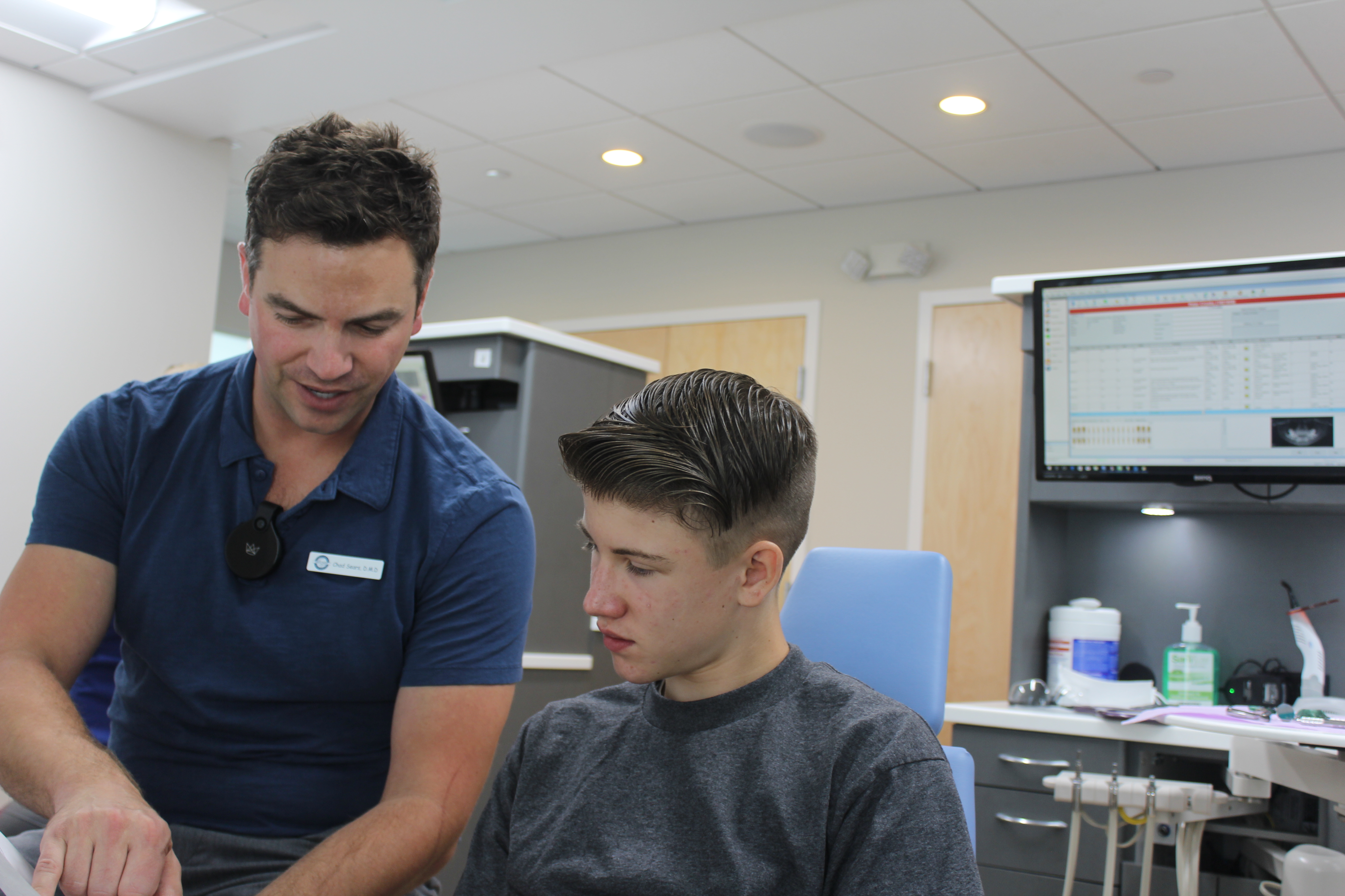 Dr. Sears talking with a patient