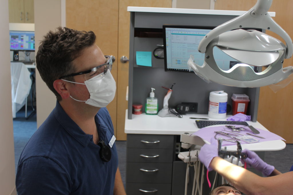 Dr. Sears working with a patient