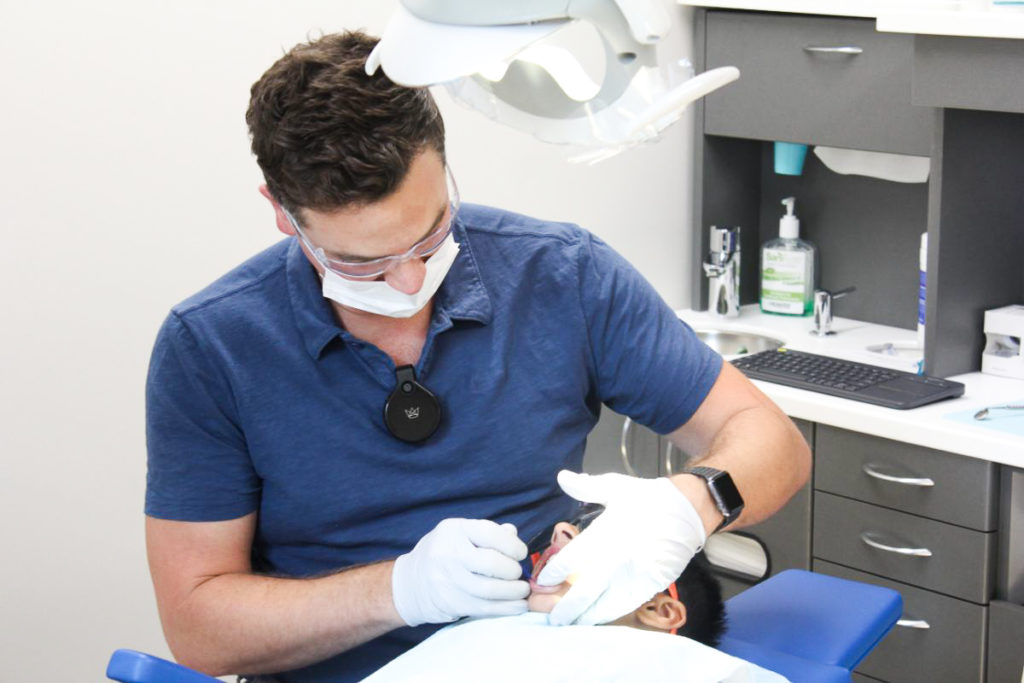 Dr. woking on patient's teeth